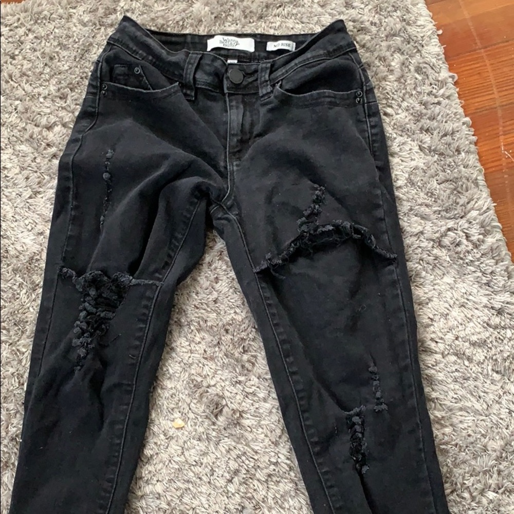 Worn once skinny black ripped jeans